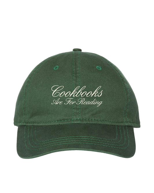 Green cap with 'Cookbooks Are For Reading' text on a white background
